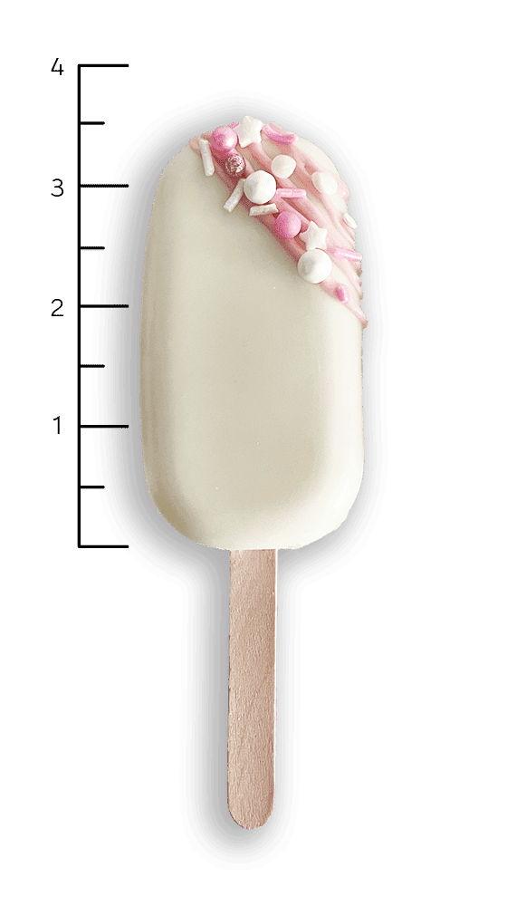 A white ice cream bar on a wooden stick with pink and white sprinkles on top, next to a vertical measurement scale labeled 1 to 4.