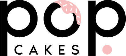 The logo reads "pop cakes" in bold letters. The first "o" resembles a donut with pink icing and sprinkles, and the letter "a" in "cakes" is dotted with a pink circle.